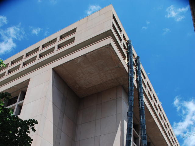 External plastic chute on building exterior